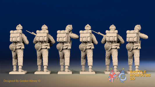 WW2 British Commandos in cap comforters standing firing, rear view