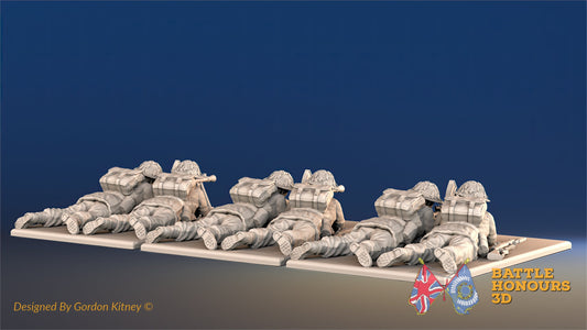 British Commando Bren gun team firing prone in smocks rear view