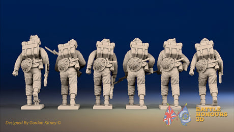 WW2 British Commandos in cap comforters with Bren guns advancing, rear view