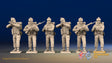 WW2 British Commandos in cap comforters standing firing, front view