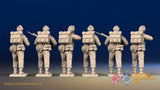 WW2 British Commandos in cap comforters standing firing, rear view