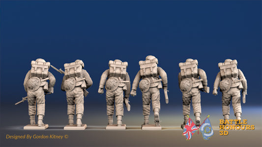 Royal Marine Commandos advancing in battle dress rear view