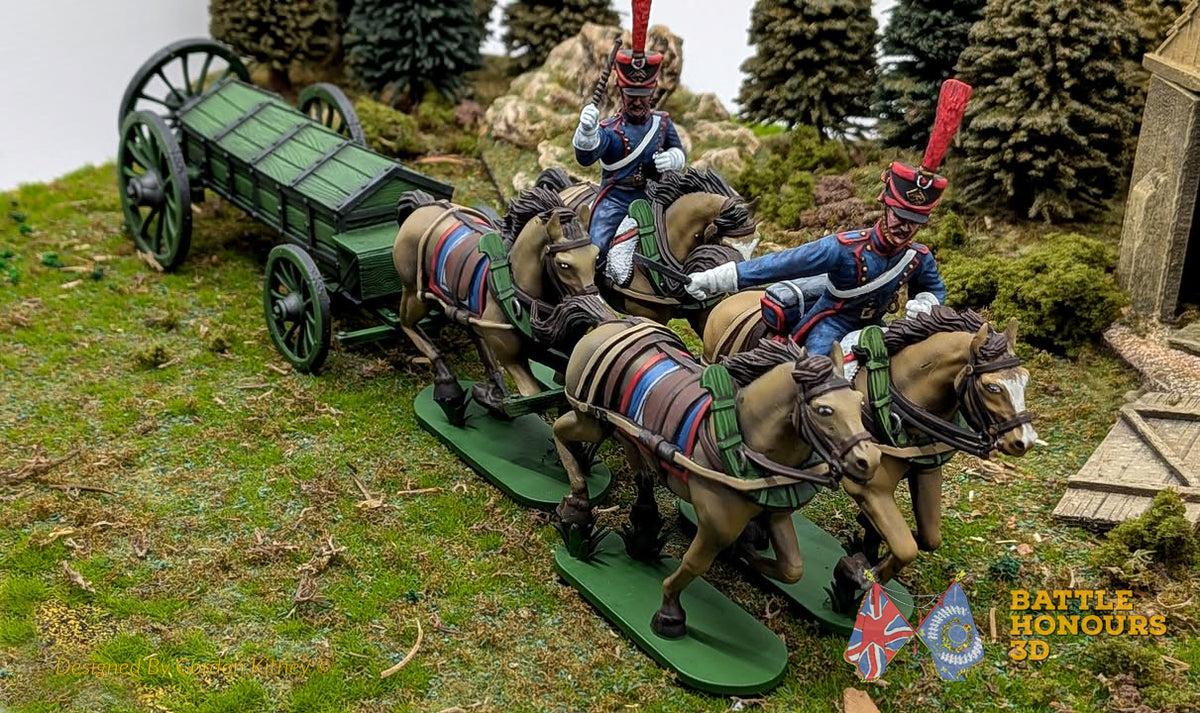 Painted Napoleonic horse team pulling a green artillery limber through miniature scenery
